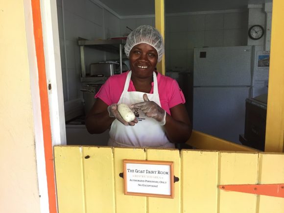 Woman smiling holding cheese