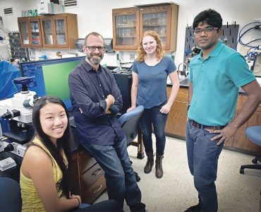 Andrew Lypm and lab students posing