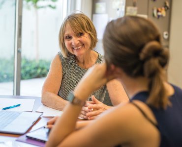 Jan Osborn working with student