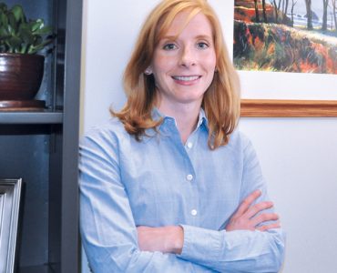 professor with arms crossed