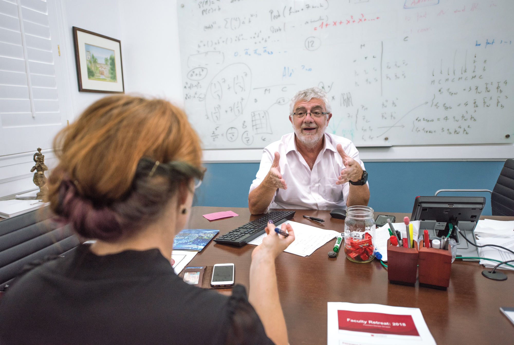 President Struppa talking at his desk