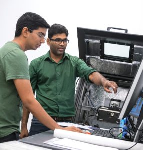 two students looking at computer