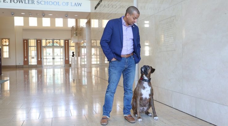 Man with Dog in Kennedy Hall, Chapman University