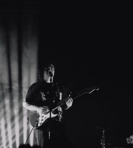 Man playing guitar on stage