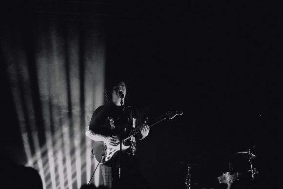 Man playing guitar on stage