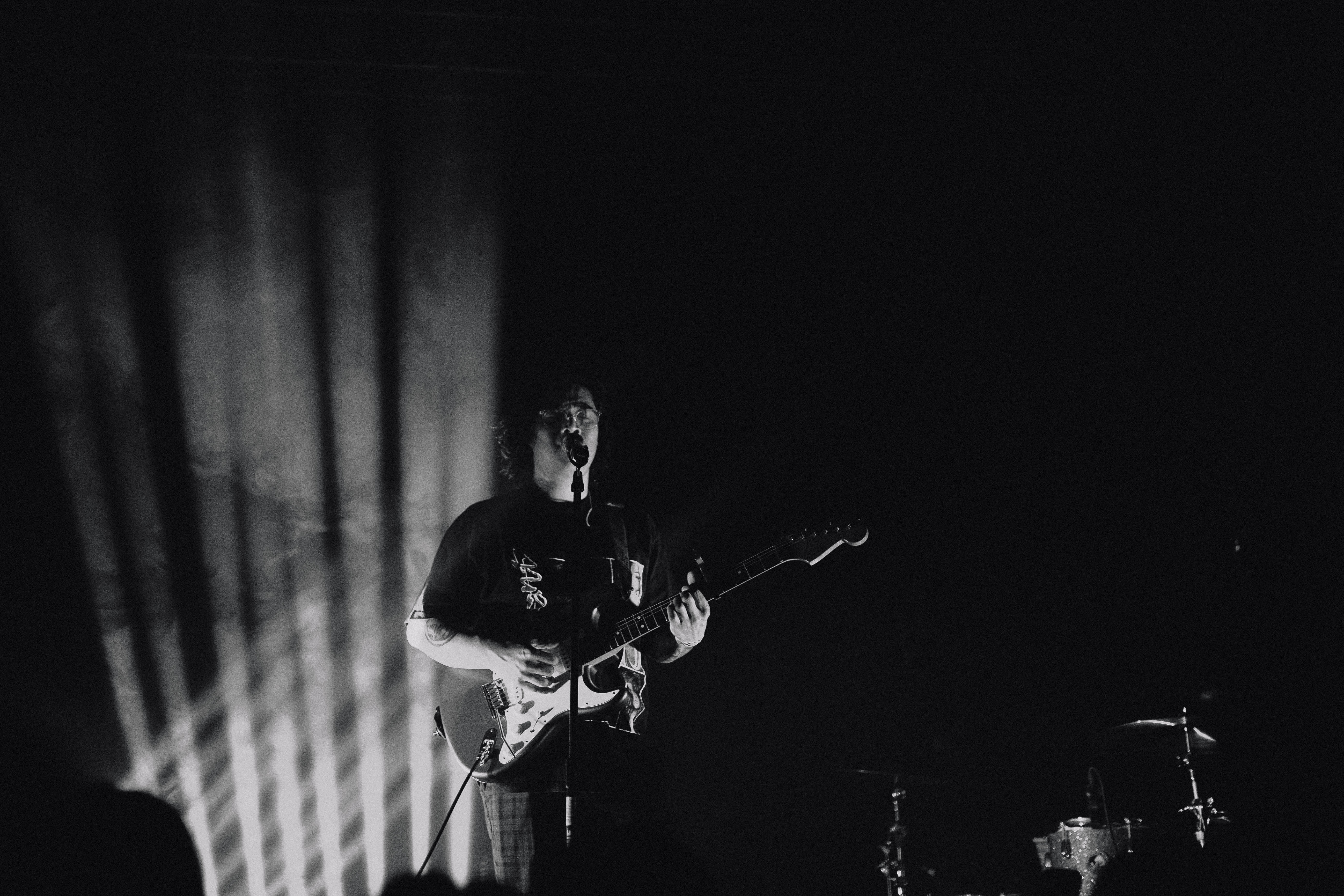 Man playing guitar on stage