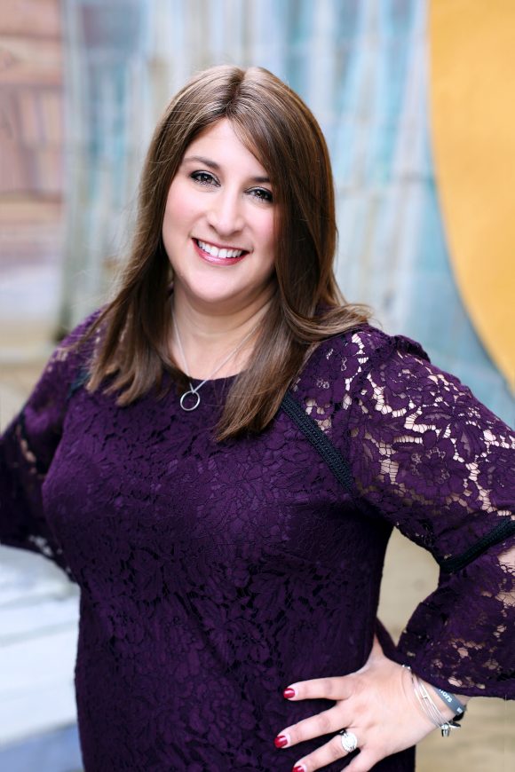 Rabbi Corie Yutkin, director of Jewish life, smiling in the Fish Interfaith Center