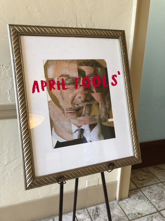 Framed portrait outside of office, with "April Fools'" written on it.