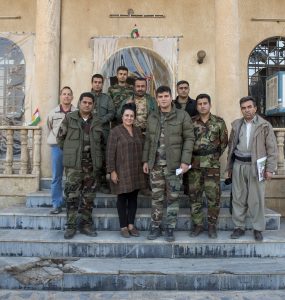 Kelly Galindo with Kurdish soldiers who provided security during her filming in Iraq. (Photo courtesy of Alberto De Coste Calla)