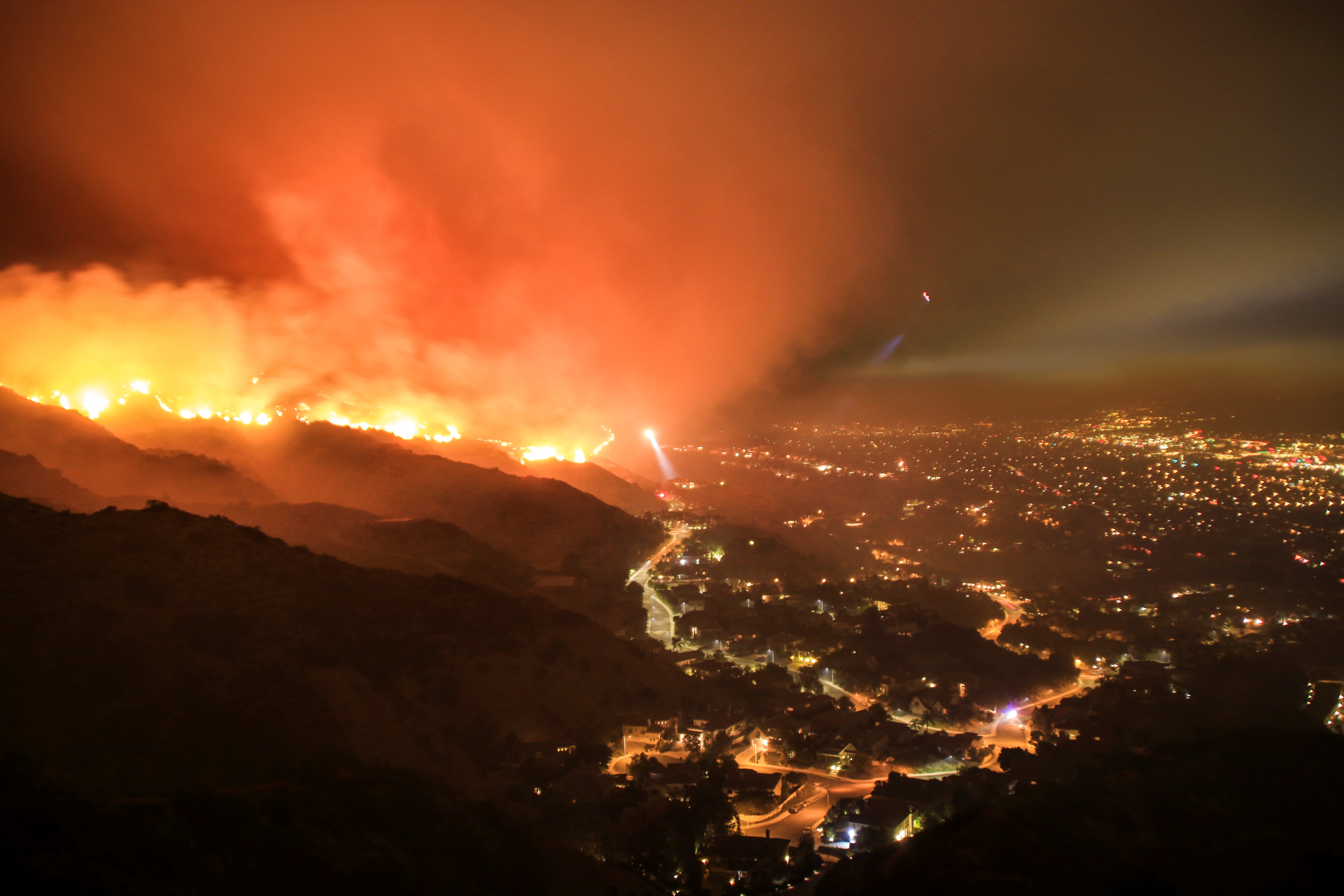 Rescue teams evacuating neighborhood from wildfire