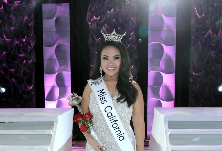 Eileen Ki in white evening gown with Miss California crown, sash and scepter