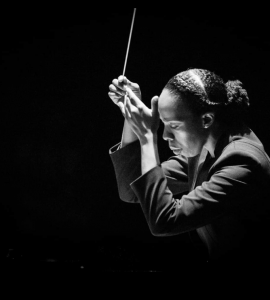 Close up of African American woman conducting orchestra