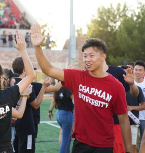 First-year Chapman University student high five