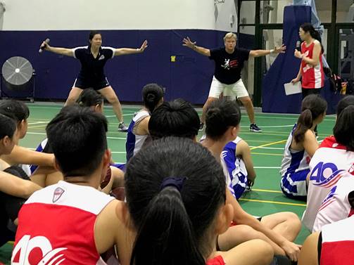 Carol Jue and Holly Warlick demonstrate defensive moves