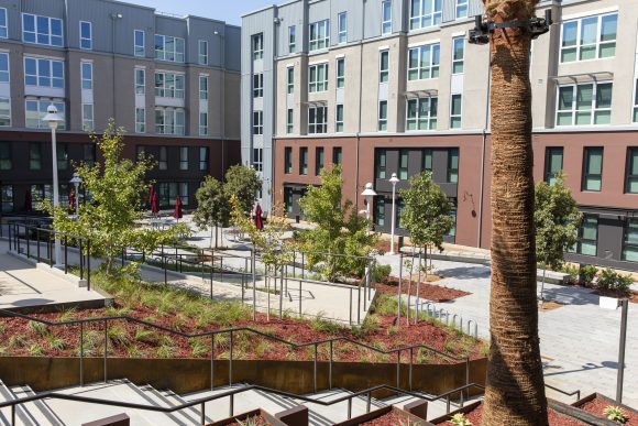 Open courtyard between brick buildings