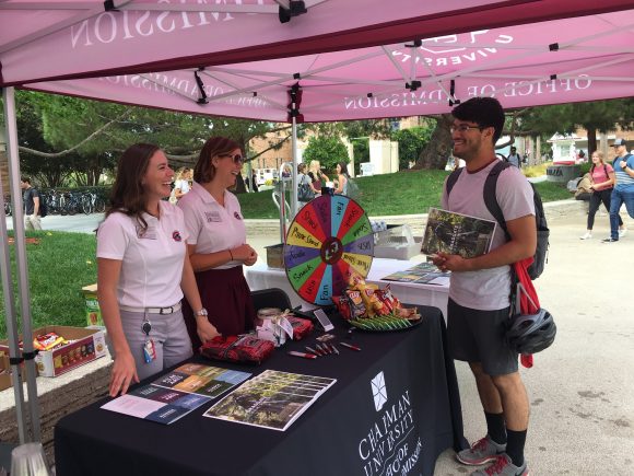 Chapman University students talk with guests at the Involvement Fair
