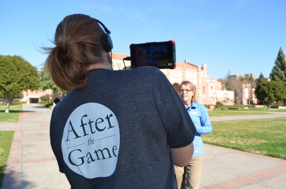 Woman with After the Game Tshirt filming