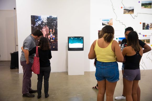 Visitors observe the gallery.