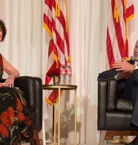 Julianne Argyros and former President Bush enjoy a light moment during their Q&A dialogue at the Argyros School celebration dinner.