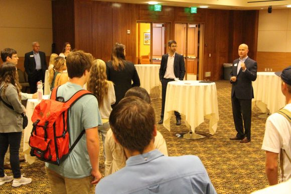 Paul Cook (right) with Prof. Goldsmith (left) tells attendees about his career path