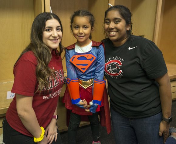 Chapman students giving youth a 3D printed costume.