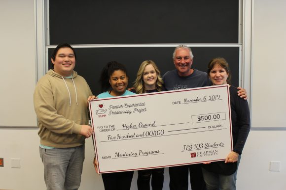 5 people and a giant check