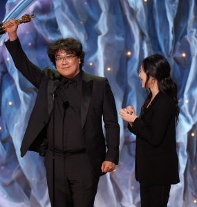 Bong Joon-ho holds up Oscar