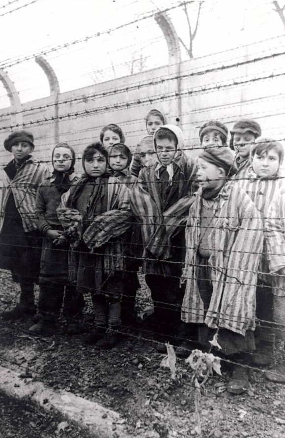 children behind barbed wire