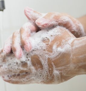 close up of hand washing with soap