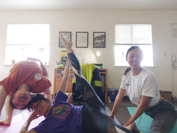 Three women doing yoga