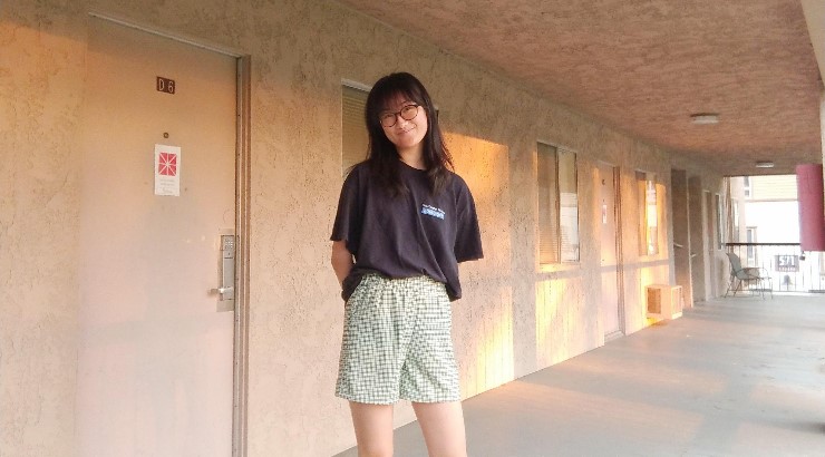 Woman standing in outdoor hall