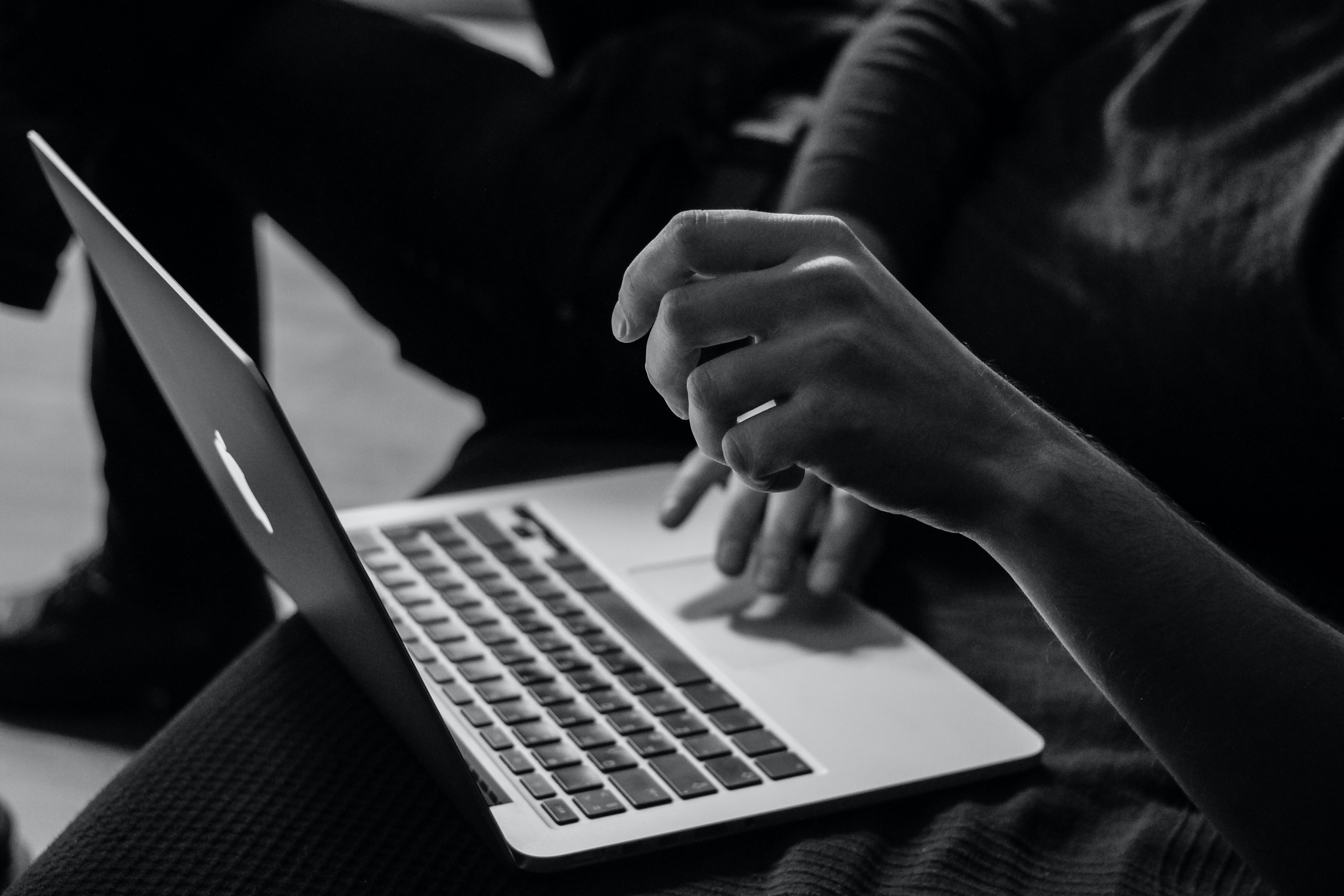 hands on a laptop