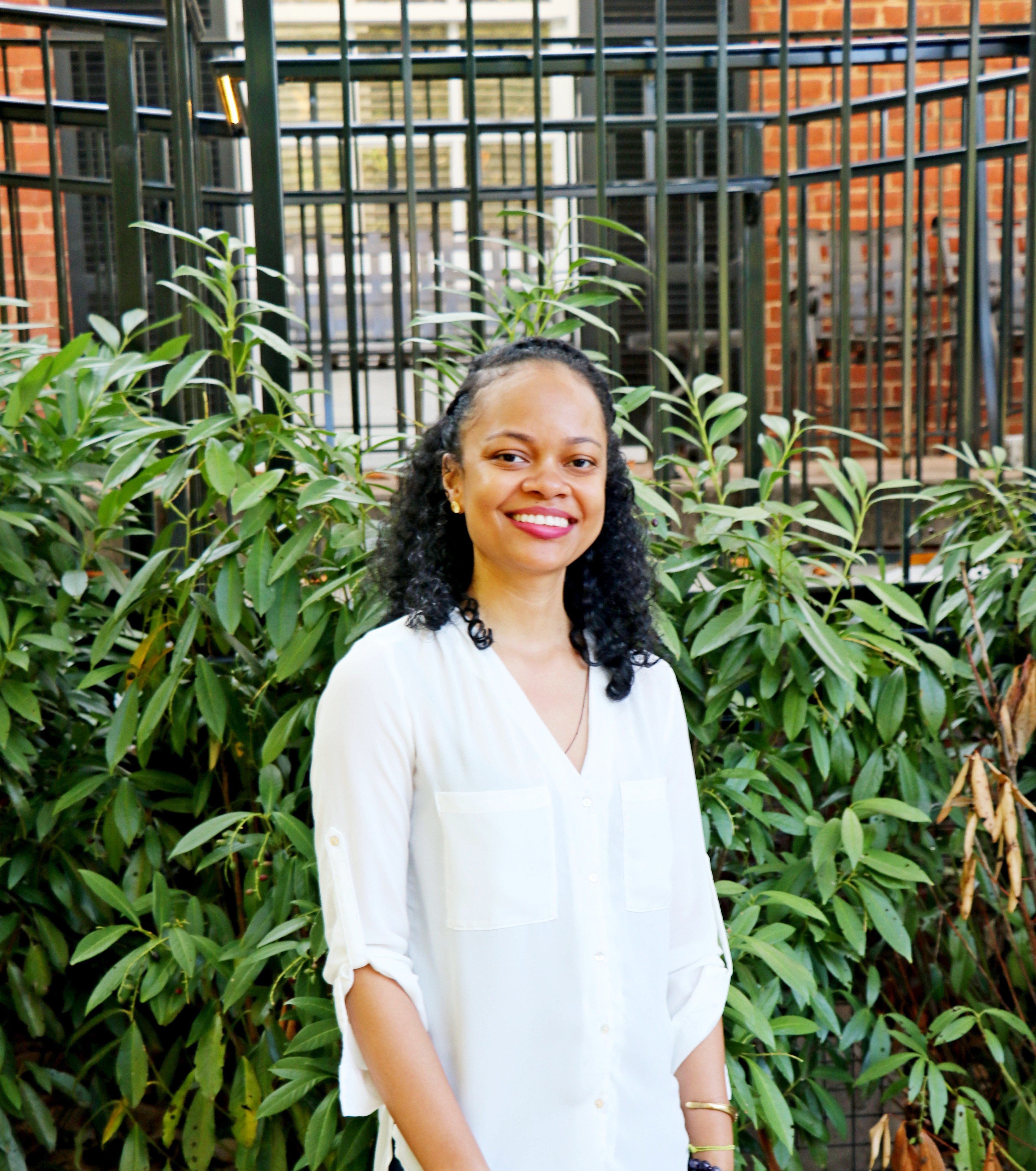 Angelica Allen poses outside a building. 