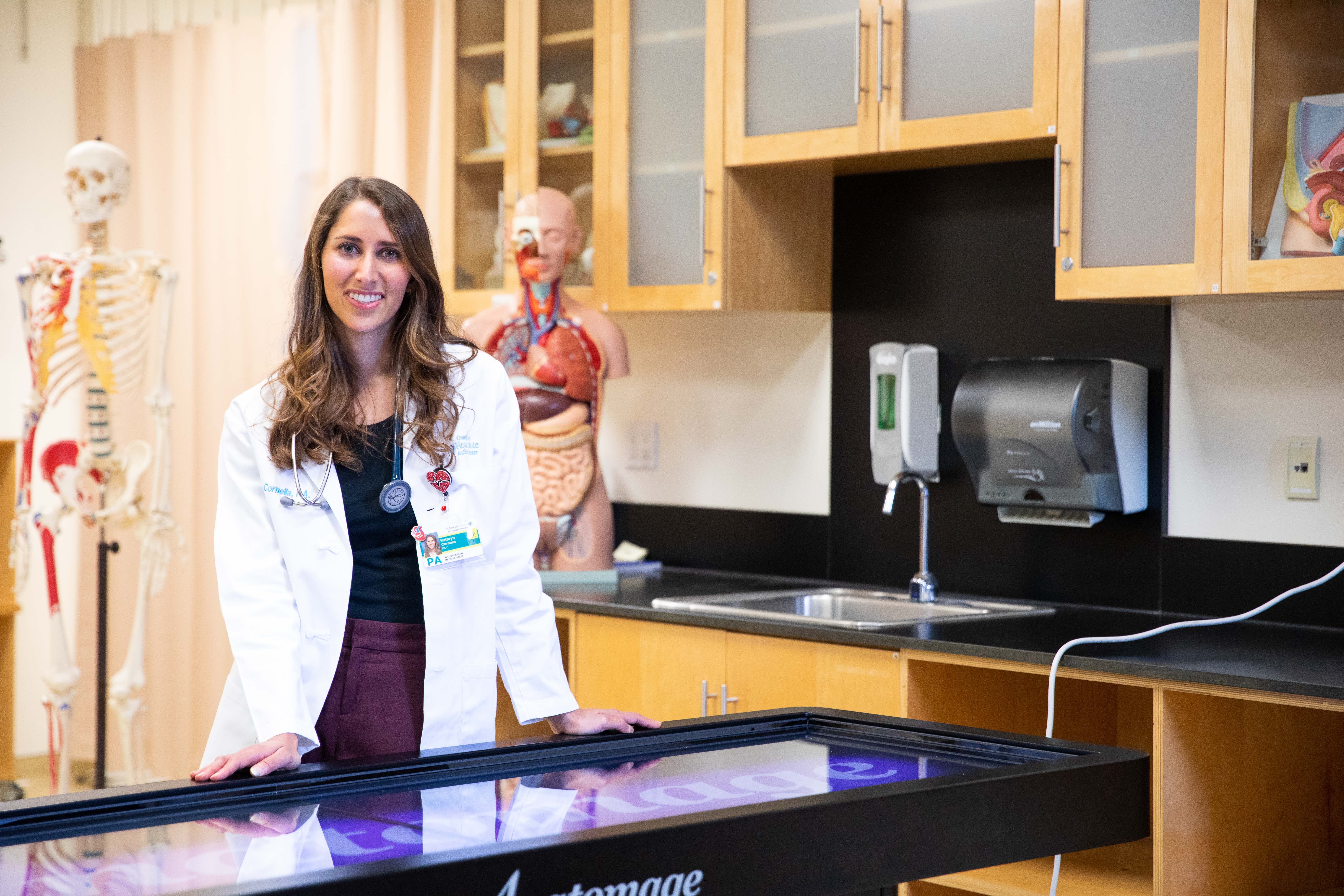 Woman in labcoat smiling