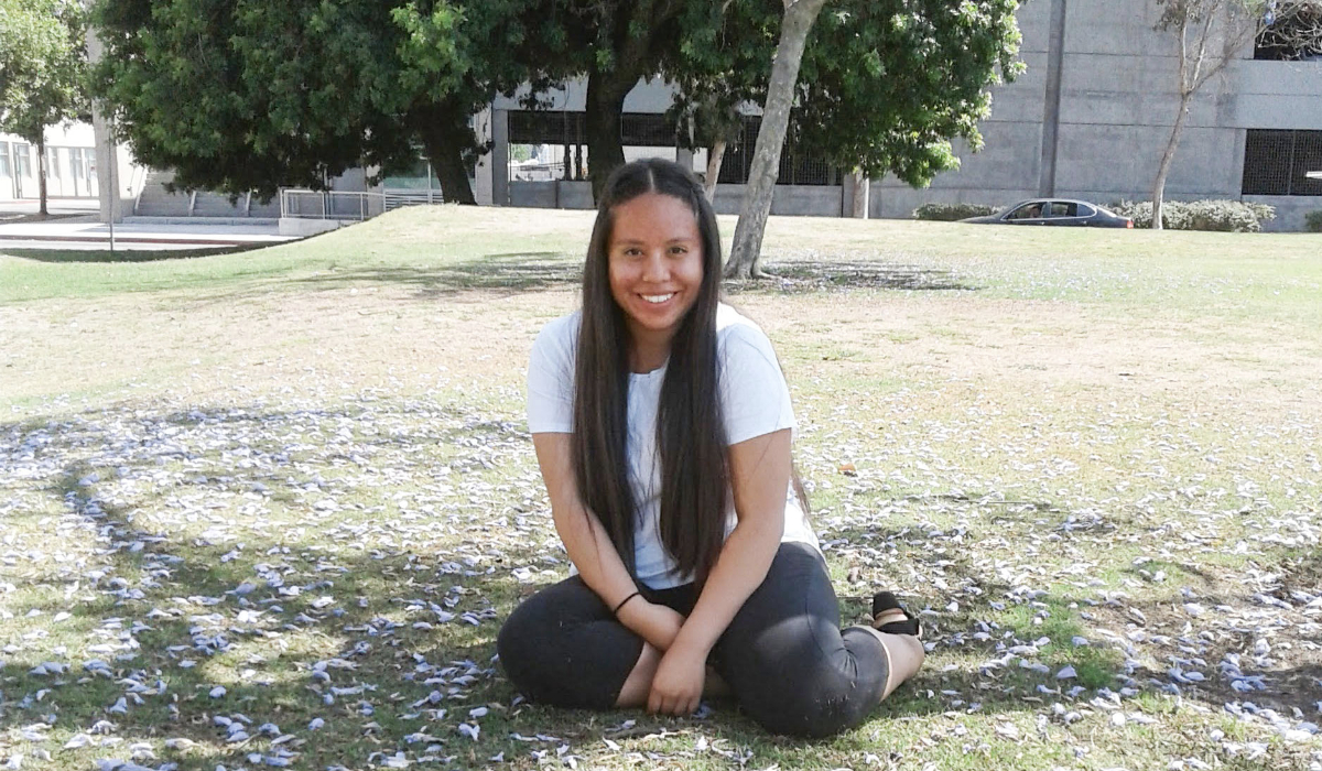 Adelin Tiburcio under a tree