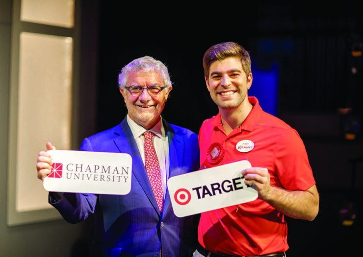 President Struppa poses next to a Chapman alumnus who is a Target corporate employee.