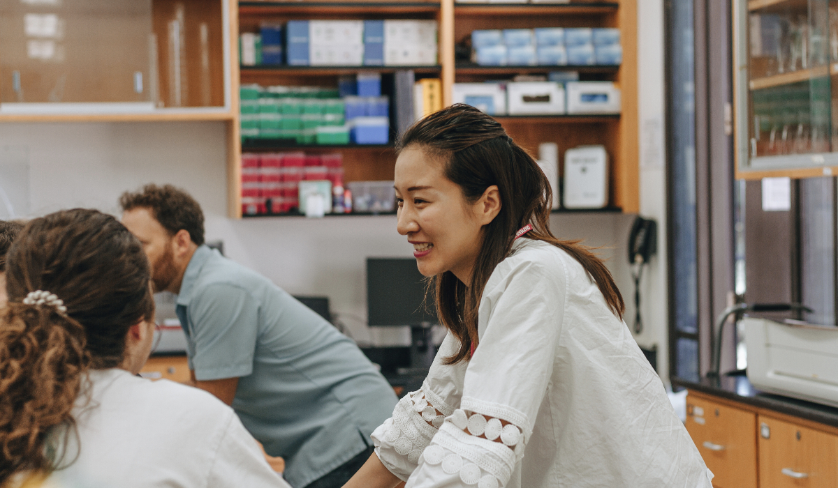 Bengjie Zhang, Ph.D., a postdoctoral research and teaching fellow at Chapman, works with a Grand Challenges Initiative student team on a pre-COVID-19 project.