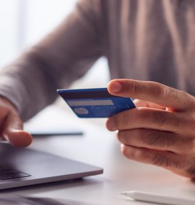 Person doing online shopping from laptop.