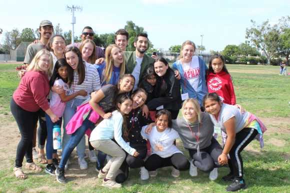 Professor Quaylan Allen, Ph.D., back row, second from the left, with a group of students from Chapman and Higher Ground Youth.