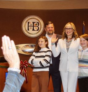 natalie moser and family in huntington beach council chamber