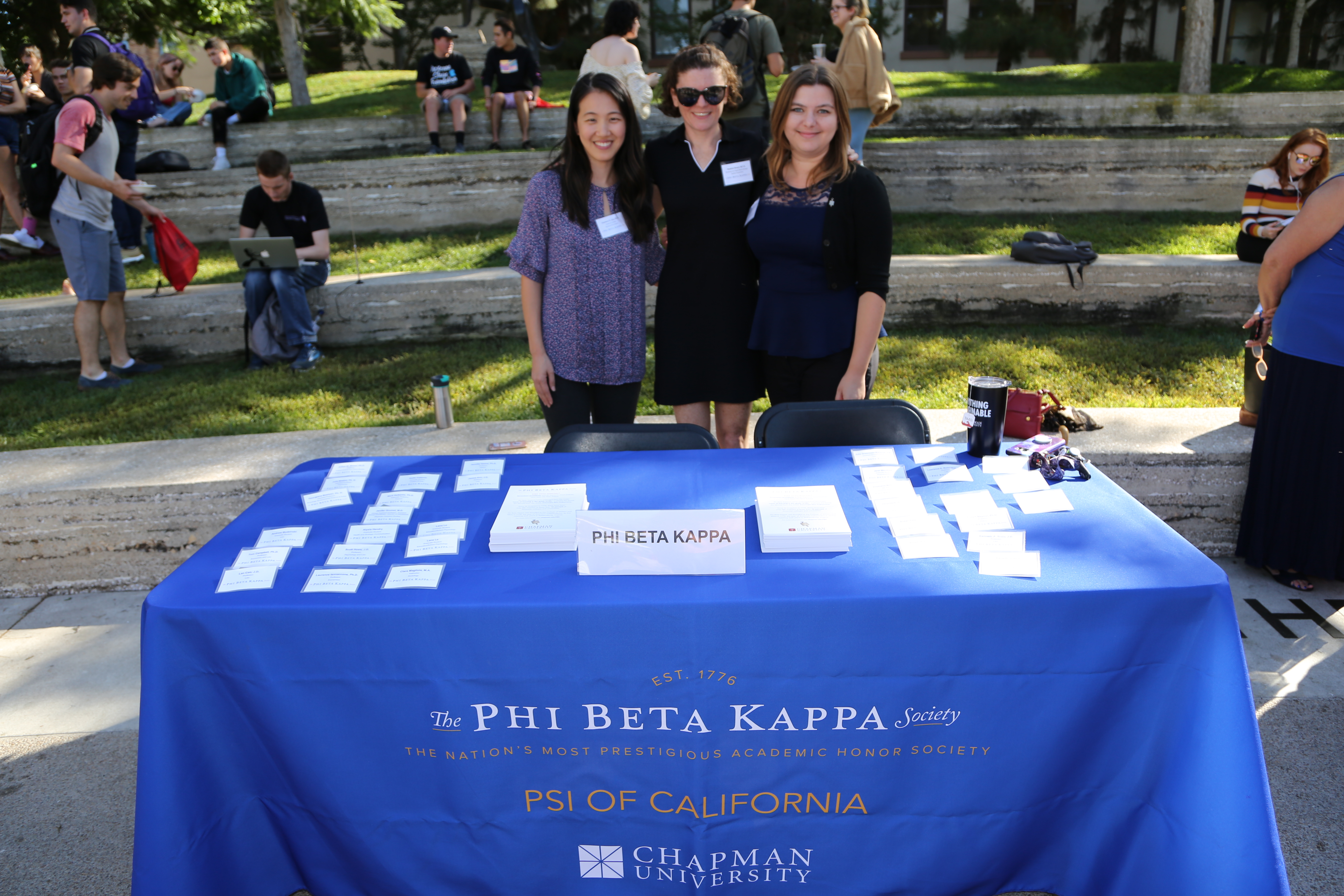 Chapman faculty and staff Phi Beta Kappa members Charlene Chu, Heather Breen, and Kristin Laughtin-Dunker answer questions at the Phi Beta Kappa table at the inaugural ice cream social and announcement event on October 9, 2018.