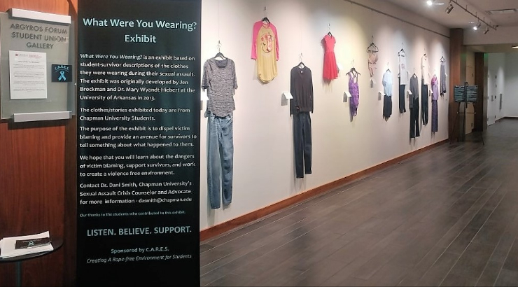 Exhibition called "What Were You Wearing" displayed on walls in Argyros Forum