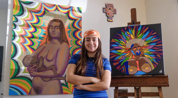 Natalia Ventura '21 poses with her artwork