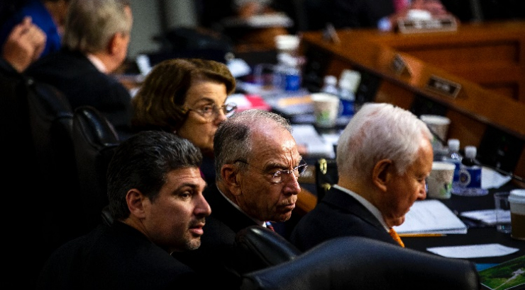 Chapman and Fowler Law graduate Joshua Flynn-Brown with Sen. Chuck Grassley in a Senate hearing.