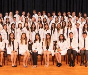 The class of 2021 and the Dean at their White Coat Ceremony in September 2018.