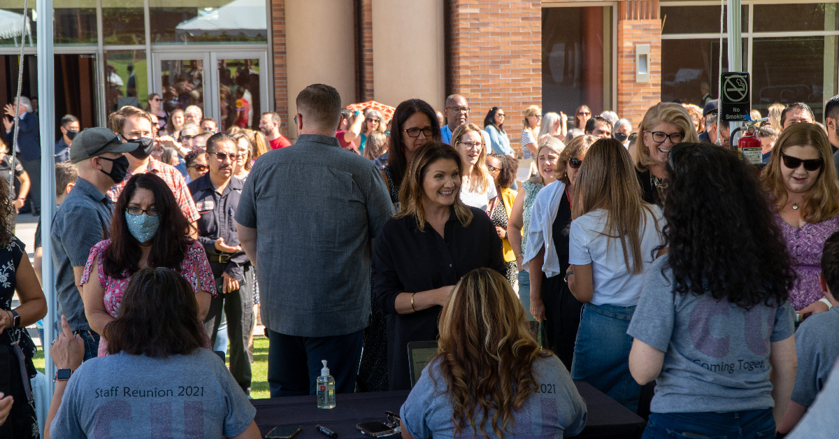 Staff gathered together outside of Musco Center for the Arts.