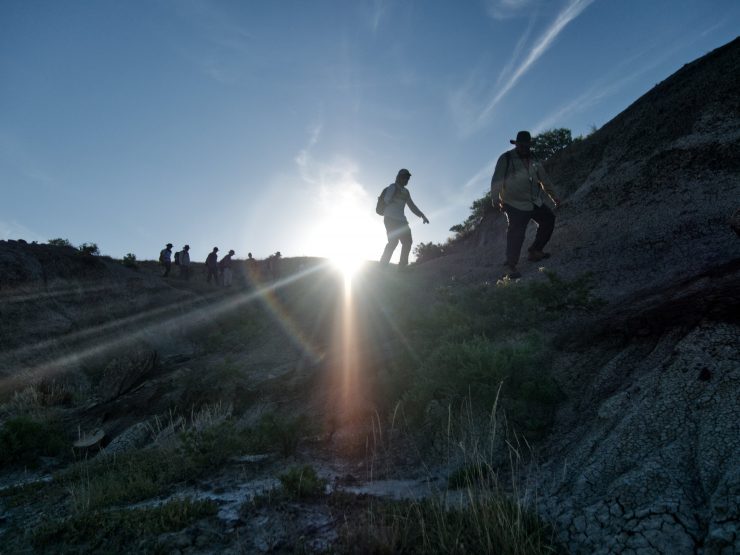 students walking to dinosaur dig site