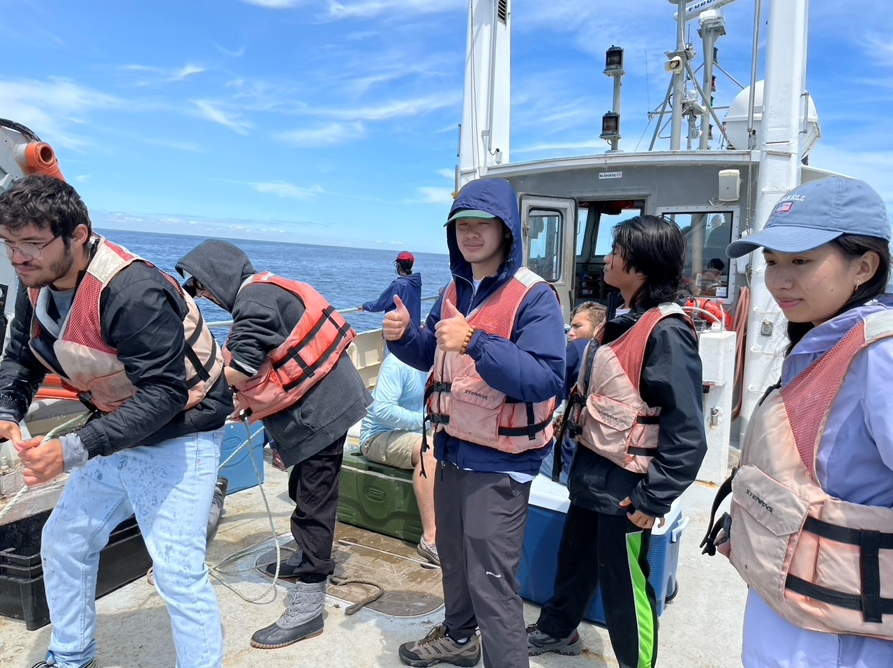 Peter Ly on a research boat off the coast of Appledore Island, Maine
