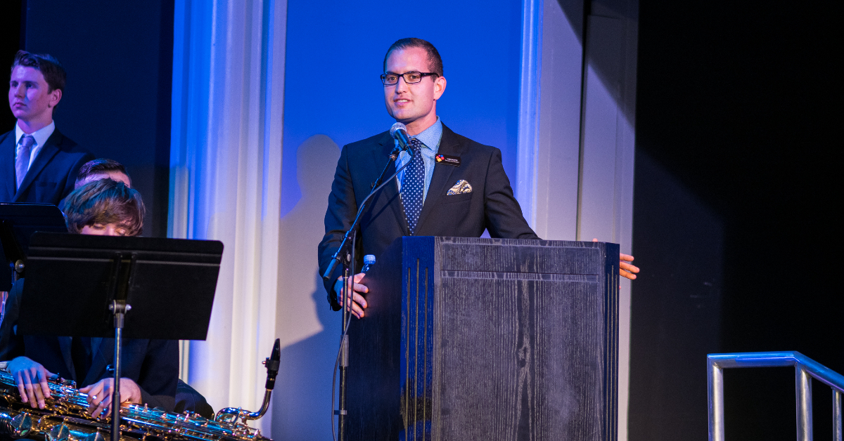 Teren Shaffer at the podium during a concert.
