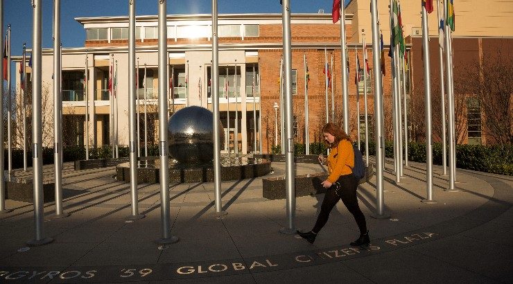 Chapman student walking throught Global Citizens Plaza